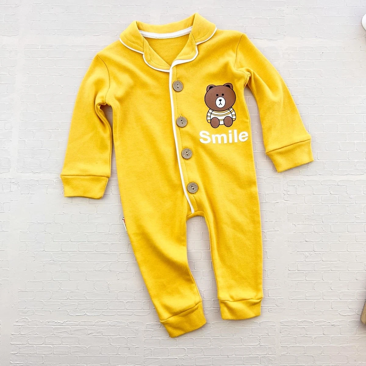 bebek tulum 3-18 ay smile yazı baskılı düğmeli sarı 
